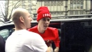 Justin Bieber shouts at a photographer during an altercation in London on Friday, March 8, 2013.
