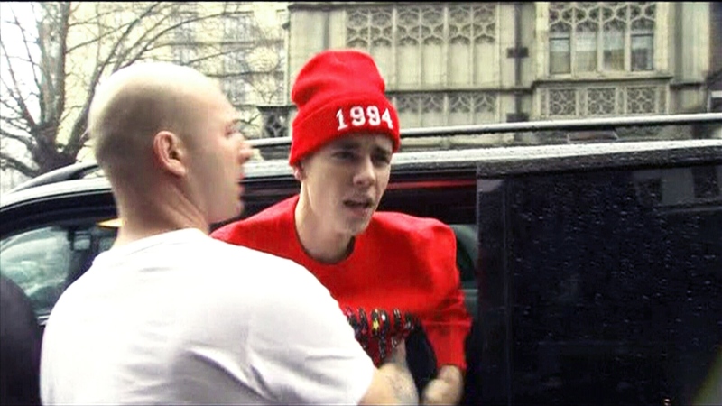Justin Bieber shouts at a photographer during an altercation in London on Friday, March 8, 2013.