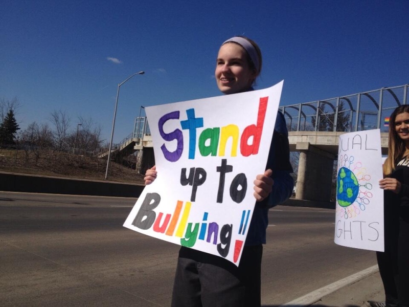 Brooke Mulligan protests outside the Catholic school board offices in Windsor, Ont., on Friday, March 8, 2013. (RIch Garton / CTV Windsor)