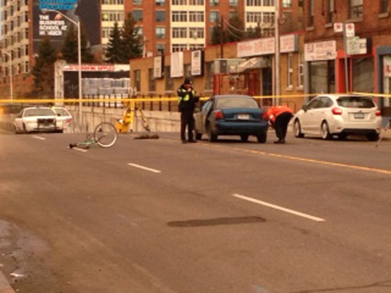 Police investigate after a cyclist was struck by a vehicle on Bloor Street West, just west of Lansdowne Avenue, on Sunday, March 10, 2013. (Jackie Crandles/CP24)