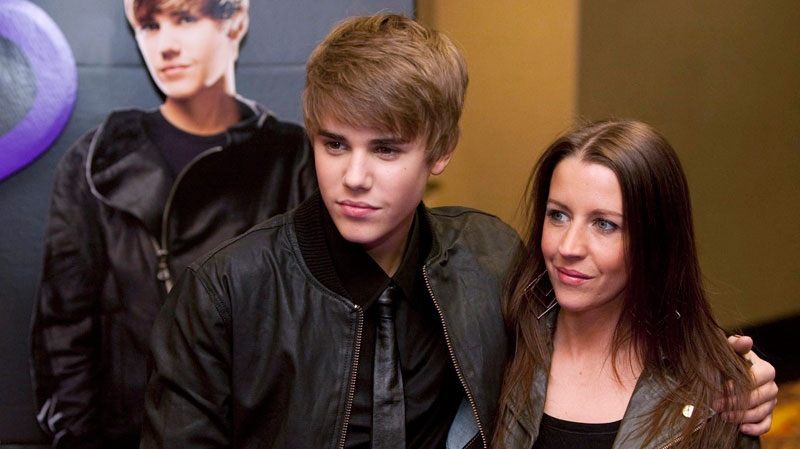 Justin Bieber, left, and his mother Pattie Lynn Mallette pose prior to the screening of his new film 'Justin Bieber: Never Say Never' in Toronto Tuesday, February 1, 2011. (Darren Calabrese / THE CANADIAN PRESS)