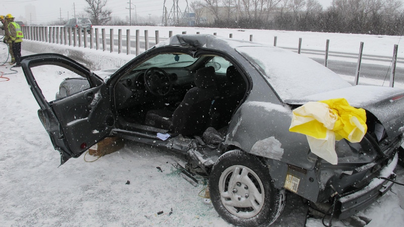 A car sits on the side of the highway after a multi-vehicle collision in Ottawa, Wednesday, Feb, 2, 2011. Photo courtesy: Ottawa Fire Services
