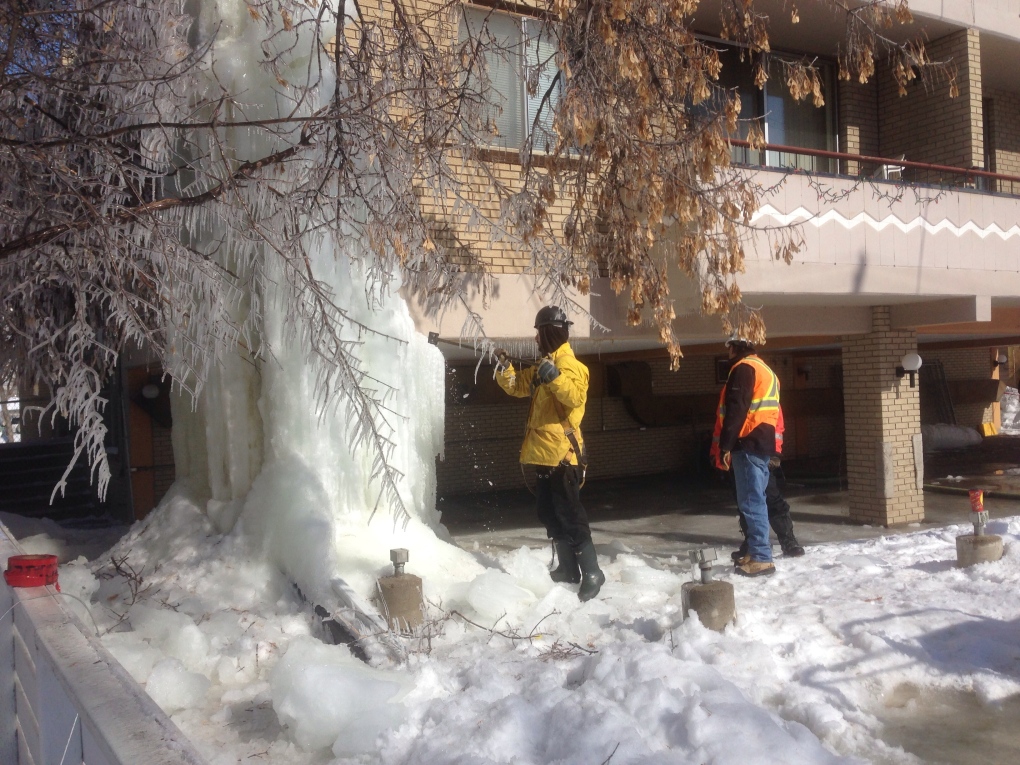 Icicle being removed from Massey Place