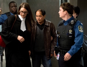 Daran Lin, father of murder victim Jun Lin, leaves the courtroom in Montreal on Tuesday, March 12, 2013. (Ryan Remiorz / THE CANADIAN PRESS)