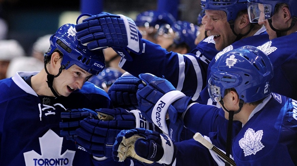 Toronto Maple Leafs forward Colby Armstrong, left, celebrates with teammates after scoring the game winning shoot-out goal defeating the Florida Panthers during NHL hockey action in Toronto on Tuesday, Feb. 1, 2011. (Nathan Denette / THE CANADIAN PRESS)   