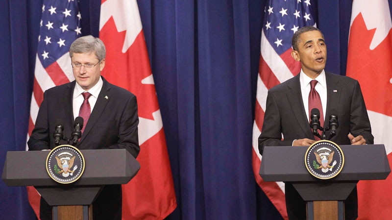 U.S. President Barack Obama and Prime Minister Stephen Harper take part in a joint news conference in the Eisenhower Executive Office Building, after their meeting at the White House in Washington, Friday, Feb. 4, 2011. (AP / Charles Dharapak)