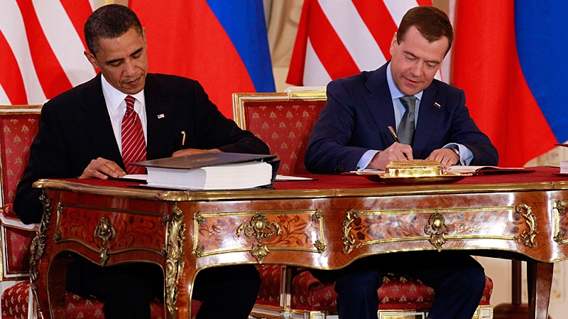 U.S.  President Barack Obama, left, and Russian president Dmitry Medvedev sign the New START treaty at the Prague Castle in Prague in this, April 8, 2010 file photo. (AP / Alex Brandon)