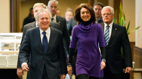 Quebec Premier Jean Charest and Deputy Premier Nathalie Normandeau arrive for a meeting on the Northern Plan dealing with strategies to develop the north of Quebec in Montreal, Friday, Feb. 4, 2011. (Ryan Remiorz / THE CANADIAN PRESS)