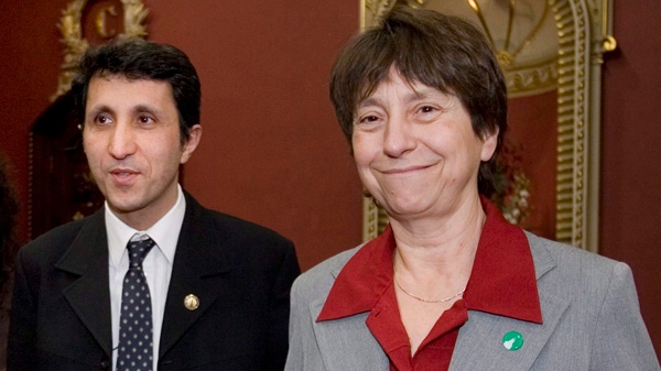 Quebec Solidaire MNA Amir Khadir and party leader Francoise David en route to a news conference after he was sworn in as legislature member Wednesday, Dec. 17, 2008 at the Quebec legislature. THE CANADIAN PRESS/Jacques Boissinot