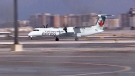 An Air Canada flight makes an emergency landing at Pearson International Airport in Toronto, Wednesday, March 20, 2013.