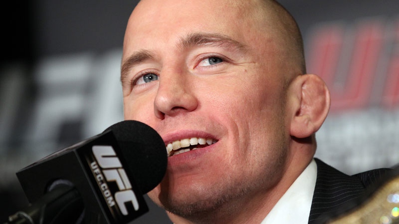 UFC 129 fighter Georges St-Pierre answers questions at a news conference in Toronto on Tuesday Feb. 8, 2011. (Frank Gunn / THE CANADIAN PRESS)