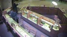 Surveillance video images released by Guelph police show two suspects during a robbery at the Peoples Jewellers in Stone Road Mall in Guelph, Ont.