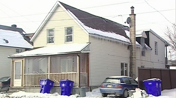 Three people were arrested after an early morning drug bust at this home in the Hull sector of Gatineau, Wednesday, Feb. 9, 2011. 