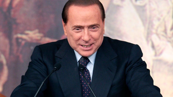 Italian premier Silvio Berlusconi talks to journalists during a press conference following a cabinet meeting at Rome's Chigi palace, Wednesday, Feb. 9, 2011. (AP / Pier Paolo Cito)