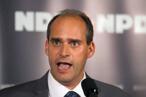 NDP MP Guy Caron responds to reporters’ questions as members of the Quebec wing of the NDP caucus meet in Quebec City in this 2011 file photo. (Jacques Boissinot/THE CANADIAN PRESS)