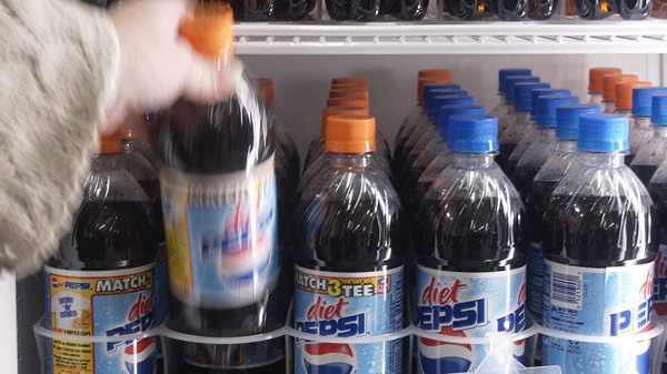 In this Dec. 2004 file photo, a customer selects a Diet Pepsi from a cooler at Handi Foods in Walesboro, Ind. (AP Photo/Darron Cummings)