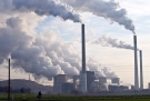 In this Dec. 16, 2009 file photo, steam and smoke is seen over the coal burning power plant in Gelsenkirchen, Germany. (AP Photo/Martin Meissner, File)
