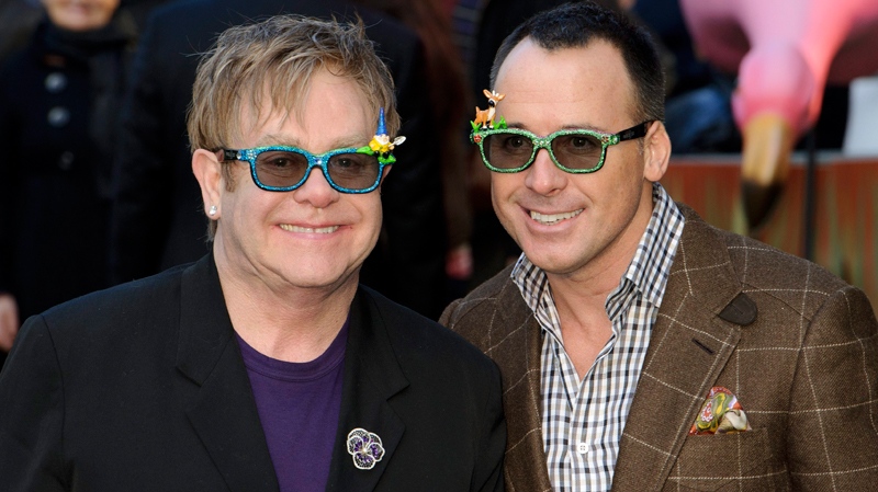 Executive producer Elton John and producer David Furnish attend the U.K. premiere of 'Gnomeo and Juliet' in central London, Sunday, Jan. 30, 2011. (AP / Jonathan Short)