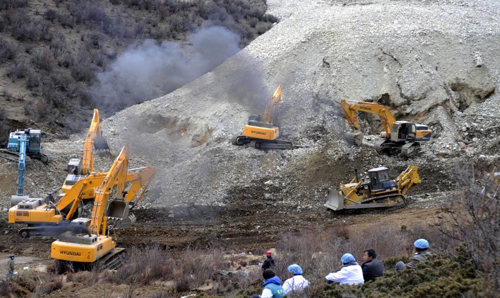 Workers at the scene of Tibet landslide