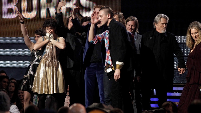 Arcade Fire accept the award for album of the year at the 53rd annual Grammy Awards on Sunday, Feb. 13, 2011, in Los Angeles. Looking on at right are presenters Kris Kristofferson and Barbra Streisand. (AP / Matt Sayles)