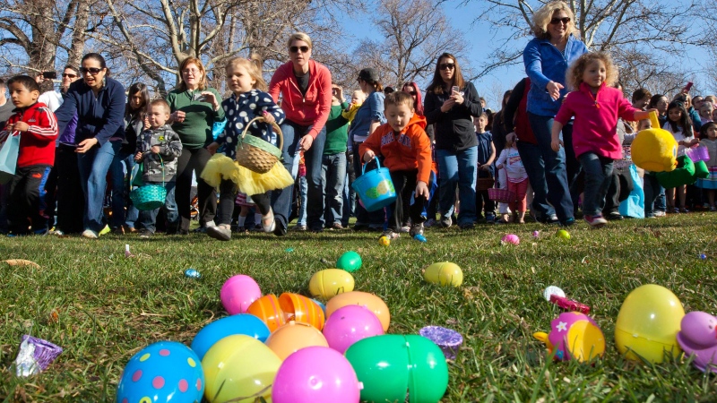 Children rush a field full of Easter Eggs, candy and other goodies Saturday March 30, 2013 during the Mix 106 Easter Egg Scramble at Julia Davis Park in Boise, Idaho. (AP / Idaho Statesman, Darin Oswald)