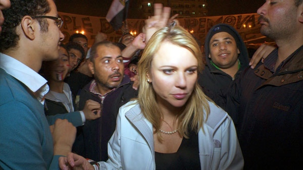 In this Feb. 11, 2001 photo released by CBS, '60 Minutes' correspondent Lara Logan is shown covering the reaction in in Cairo's Tahrir Square the day Egyptian President Hosni Mubarak stepped down. (AP / CBS News)