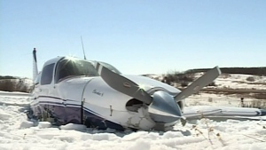 A small plane remains in a field in southeast Saskatchewan where it crashed Sunday, March 31, 2013.