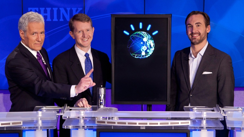 In this undated publicity image released by Jeopardy Productions, Inc., host Alex Trebek, left, poses with contestants Ken Jennings, centre, and Brad Rutter and a computer named Watson in Yorktown Heights, N.Y. on Monday, Feb. 14, 2011.