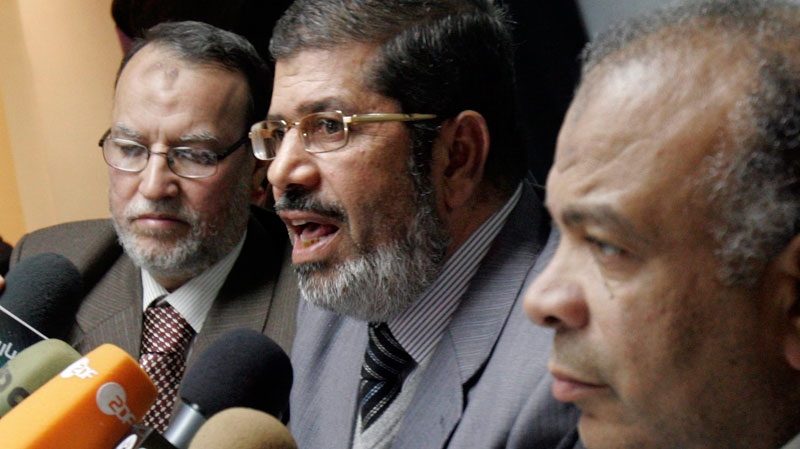 Senior members of Egypt's Muslim Brotherhood Saad el-Katatni, right, Mohamed Morsi, centre, and  Essam el-Erian hold a press conference on the latest situation in Egypt in Cairo, Egypt, Wednesday, Feb. 9, 2011. (AP / Mohammed Abou Zaid)
