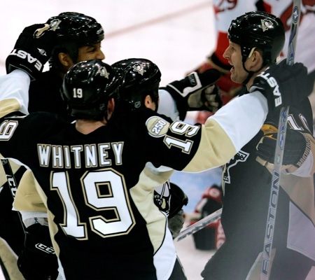 Pittsburgh Penguins' Gary Roberts, right, celebrates with teammates Georges Laraque, left rear, and Ryan Whitney -19- after scoring a first-period goal against the Ottawa Senators in a first-round NHL hockey playoff game in Pittsburgh on Wednesday, April 9, 2008. 