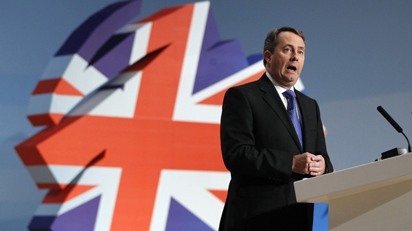 In this Oct. 6, 2010 file photo, Britain's Defence Secretary Liam Fox delivers a keynote speech at the Conservative party conference in Birmingham, England. (AP Photo/Kirsty Wigglesworth)