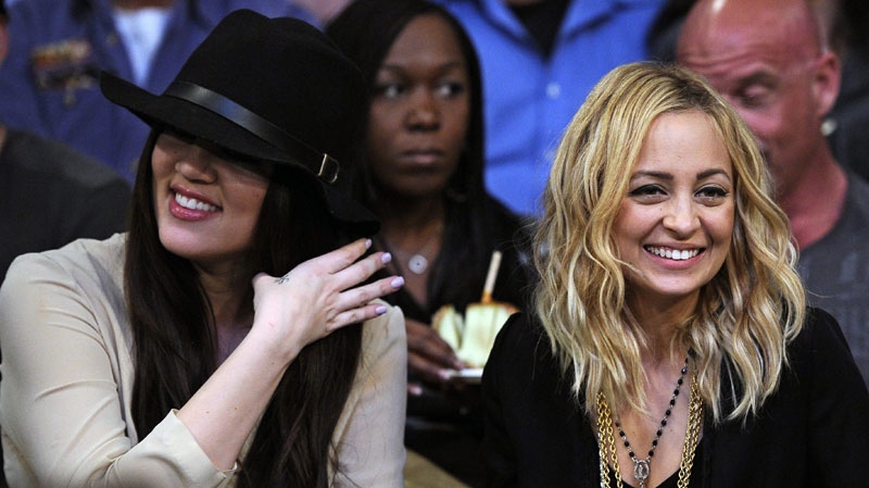 Khloe Kardashian, left, and Nicole Richie watch during the second half of the Los Angeles Lakers' NBA basketball game against the Sacramento Kings, Friday, Jan. 28, 2011, in Los Angeles. (AP Photo/Mark J. Terrill)