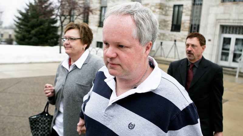 William Melchert-Dinkel, centre, leaves the Rice County Courthouse with his attorney Terry Watkins, right, and wife, Joyce Melchert-Dinkel, after waiving his right to a jury trial Thursday, Feb. 17, 2011.(AP / Robb Long)