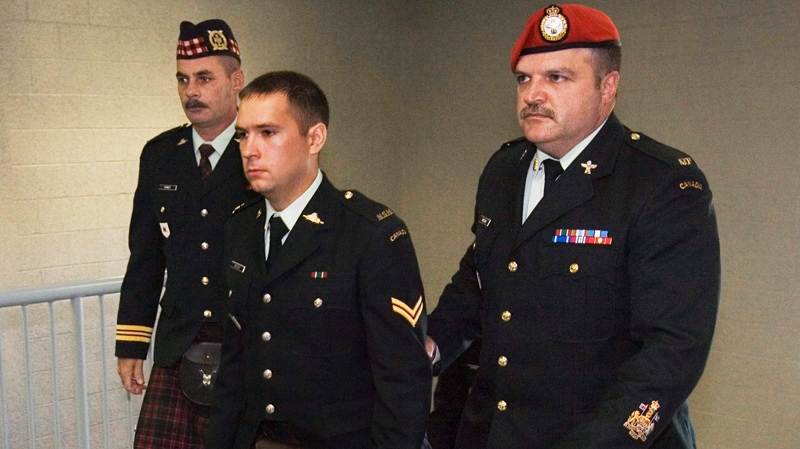 Cpl. Matthew Wilcox of Glace Bay, N.S., is escorted at his court martial during a break in proceedings in Sydney, N.S. on Wednesday, Sept. 30, 2009. (Andrew Vaughan / THE CANADIAN PRESS)