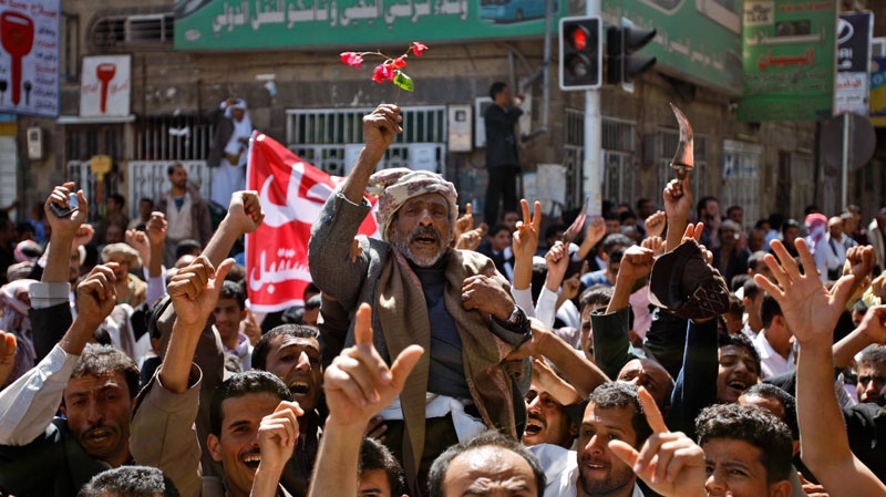Yemeni anti-government demonstrators chant slogans during a demonstration demnading the resignation of President Ali Abdullah Saleh in Sanaa, Yemen, Friday, Feb. 18, 2011. (AP / Hani Mohammed)