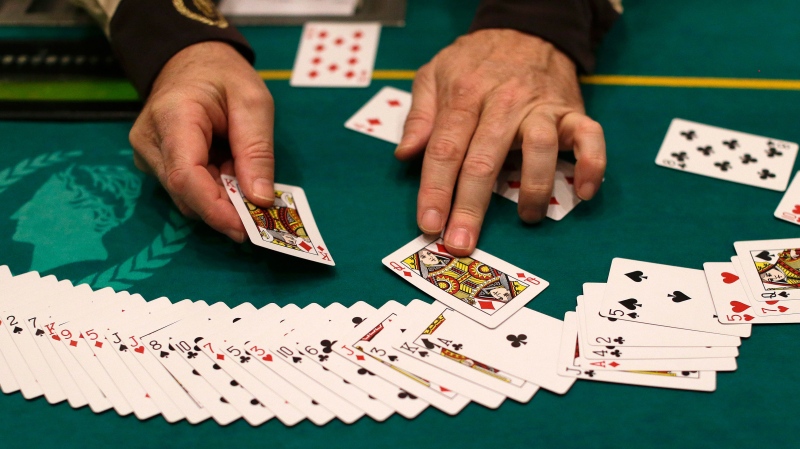 Jeff Martos resets a deck of cards during a break in poker play at Caesar's Palace, Wednesday, Feb. 27, 2013, in Las Vegas. (AP / Julie Jacobson) 