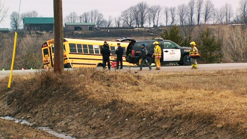 A school bus is seen on the side of the road after a crash near the intersection of Vasey and Old Fort roads, about 125 kilometres north of Toronto, on Tuesday, April 9, 2013.