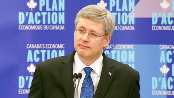 Prime Minister Stephen Harper listens to a question in Vancouver on Monday, Feb. 21, 2011.
