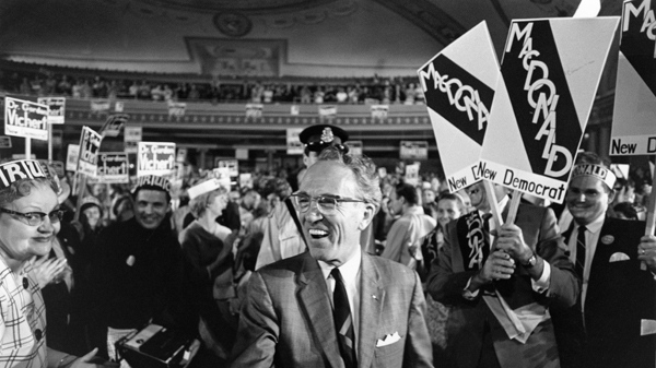 Tommy Douglas receives a standing ovation while arriving at the Palace Theatre to address an NDP rally in Hamilton, Ont. on June 11, 1968. The Canadian Press