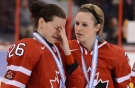 Team Canada's Tessa Bonhomme consoles Sarah Vaillancourt following their 3-2 loss to Team USA in the gold medal game at IIHF Womens World Ice Hockey championships in Ottawa, Tuesday April 9, 2013. THE CANADIAN PRESS/Sean Kilpatrick