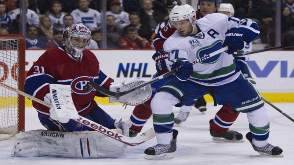 Vancouver Canucks center Ryan Kesler (17) tries to get a shot past Montreal Canadiens goalie Carey Price (31) during first period NHL action at the Rogers Arena in Vancouver Tuesday, Feb 22, 2011. THE CANADIAN PRESS/Jonathan Hayward