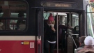 A TTC streetcar takes on passengers in downtown Toronto, Tuesday, Feb. 22, 2011.
