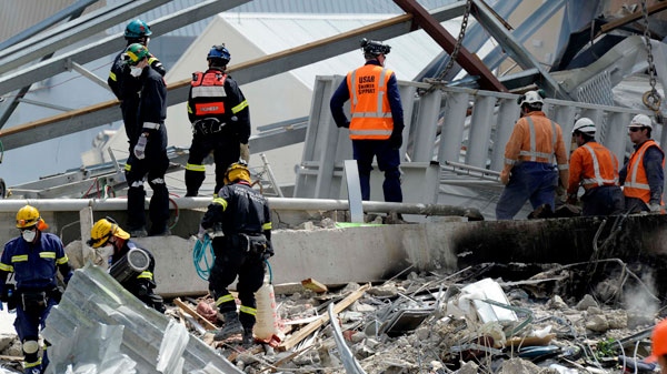Recovery operation personnel work on the destroyed CTV building in Christchurch, New Zealand, Wednesday, Feb. 23, 2011. (AP / Rob Griffith)