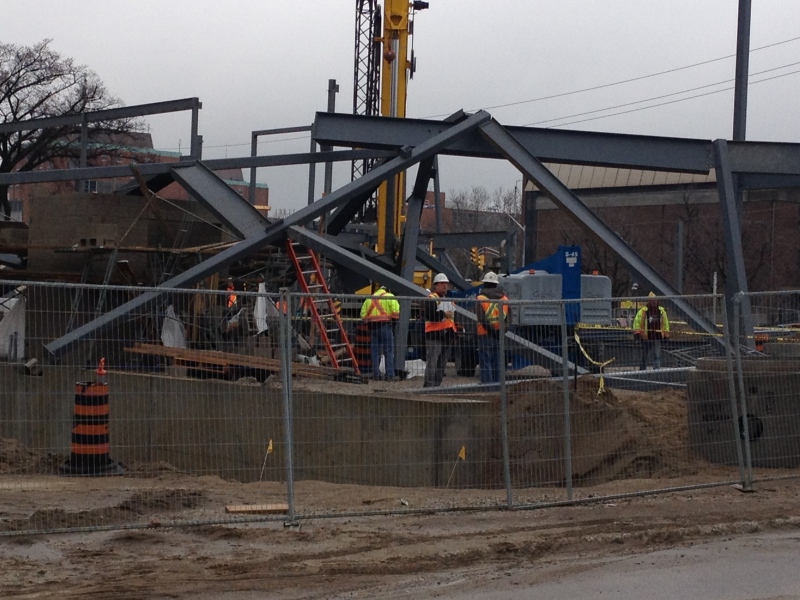 Construction workers clean up after steel beams collapsed at the University of Windsor on Friday, April 12, 2013. (Rich Garton / CTV Windsor)