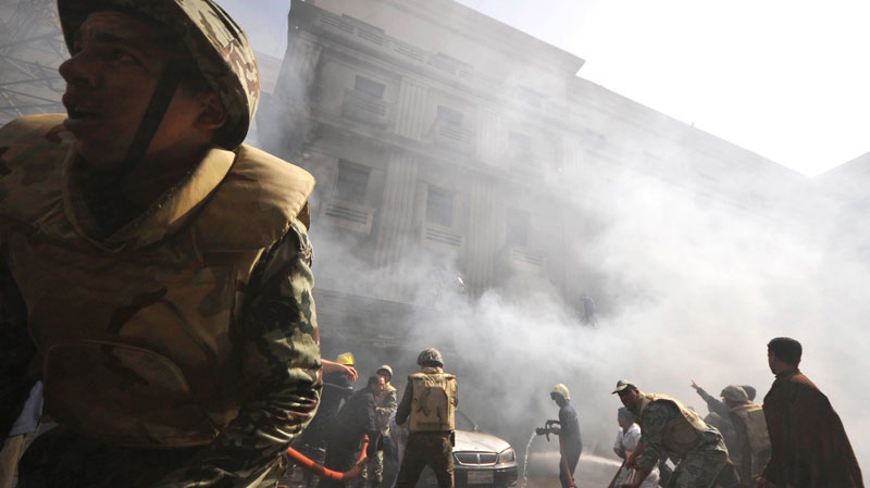 Egyptian army soldiers fight a fire believe to be set by hundreds of low-ranking police at a part of the security headquarters in Cairo, Egypt, Wednesday, Feb. 23, 2011. (AP / Hossam Khalil) 