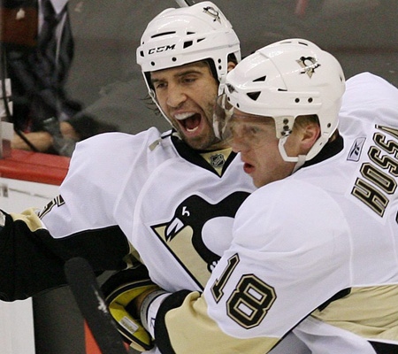 Pittsburgh Penguins' Maxime Talbot, left, celebrates his second period goal against the Ottawa Senators with teammate Marian Hossa during game three of NHL Stanley Cup first round hockey playoff action at the Scotiabank Place in Ottawa on Monday, April 14, 2008. THE CANADIAN PRESS/Sean Kilpatrick 