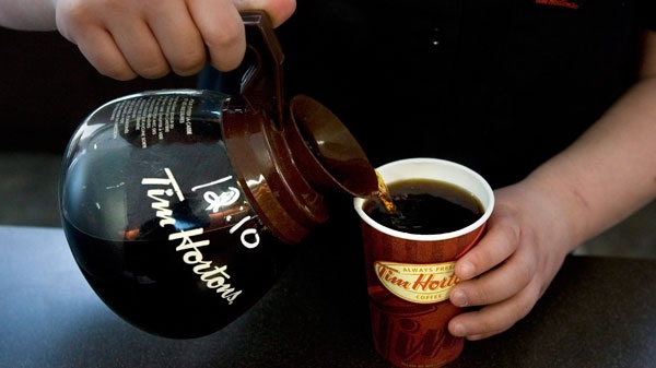 A cup of Tim Hortons coffee is poured as the company's financial year end results are announced at an AGM in Toronto on Friday May 14 2010. (Chris Young / THE CANADIAN PRESS)