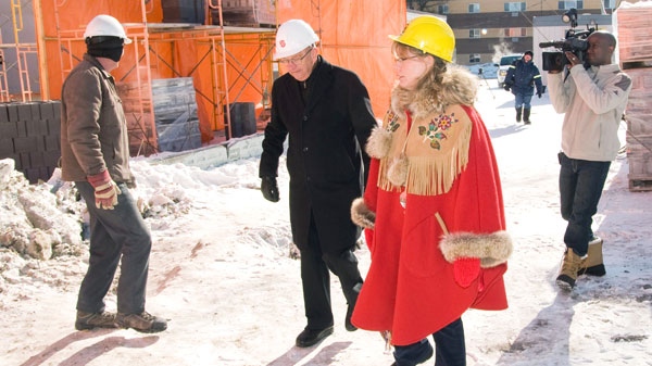 Shelly Glover, right, Conservative MP for Saint Boniface, tours the construction site at the Salvation Army Multicultural Family Centre with interim director of the centre John Nelson in Winnipeg, Thursday, Feb. 24, 2011. (David Lipnowski / THE CANADIAN PRESS)