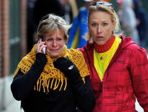 People react at Boston Marathon explosion site