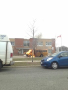 A school bus caught fire outside Thornhill Woods Public School in Vaughan on Tuesday, April 16, 2013. (@puzantyac/Twitter)